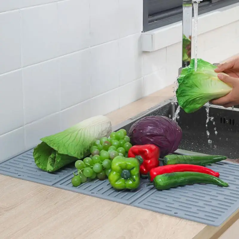 https://ae01.alicdn.com/kf/Sfa4c3ab293124a29bb8d78d92bbbc799R/Kitchen-Silicone-Dish-Drying-Mat-Heat-Resistant-Draining-Tableware-Trifold-Dinning-Mats-For-Kitchen-Collapsible-Silicone.jpg