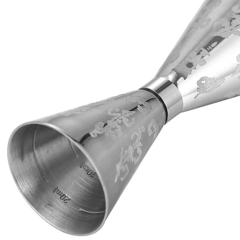 Assorted stainless steel cocktail jiggers for precise drink measurement in different sizes and finishes