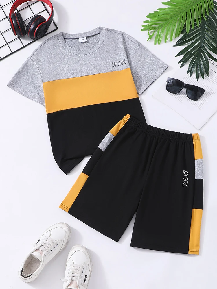 Zweiteiliges Set für Herren und Jugendliche im Frühling und Sommer, lässig, bunt, Rundhals-Kurzarm-T-Shirt und einfarbige Shorts