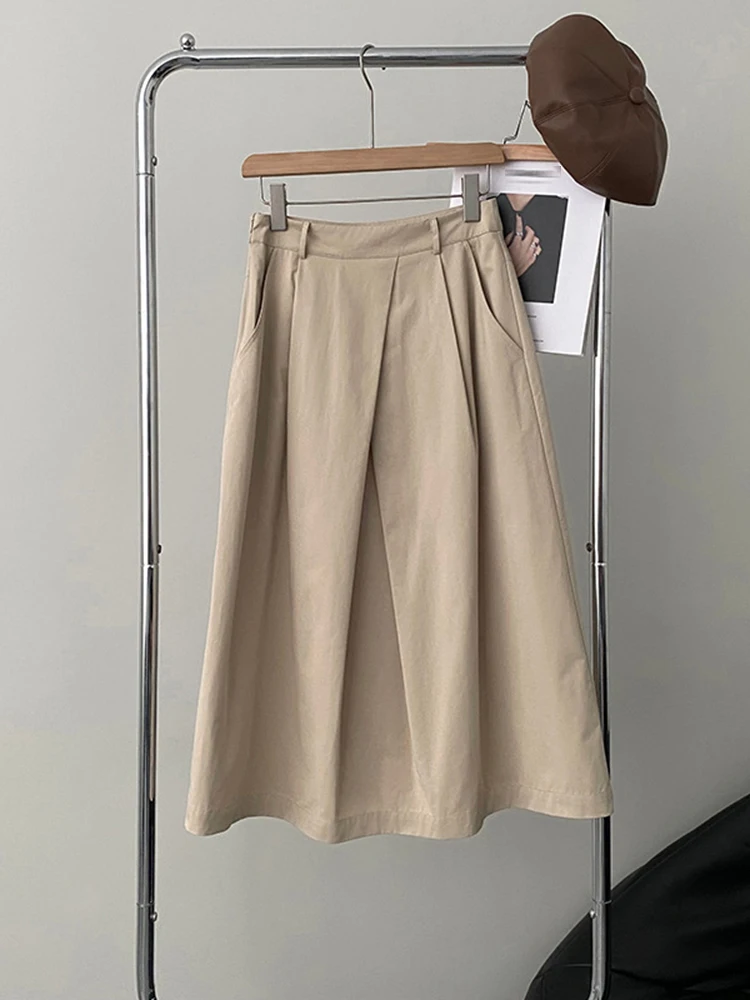 [EAM] High Waist Apricot A-line Irregular Pleated Elegant Half-body Skirt Women Fashion Tide New Spring Autumn 2026 1DH3802