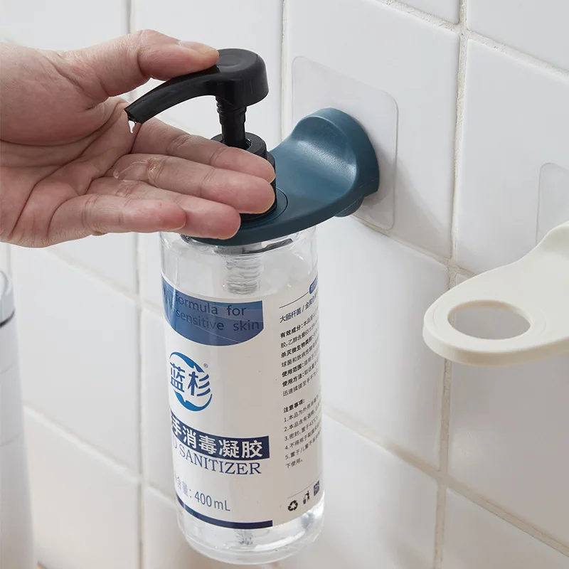 Detail du mecanisme de fixation adhesive du distributeur mural sans perceuse, compatible gel hydroalcoolique.