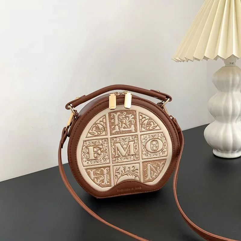 

D embroidered small round bag with advanced design, portable round cake single shoulder bag, crossbody bag