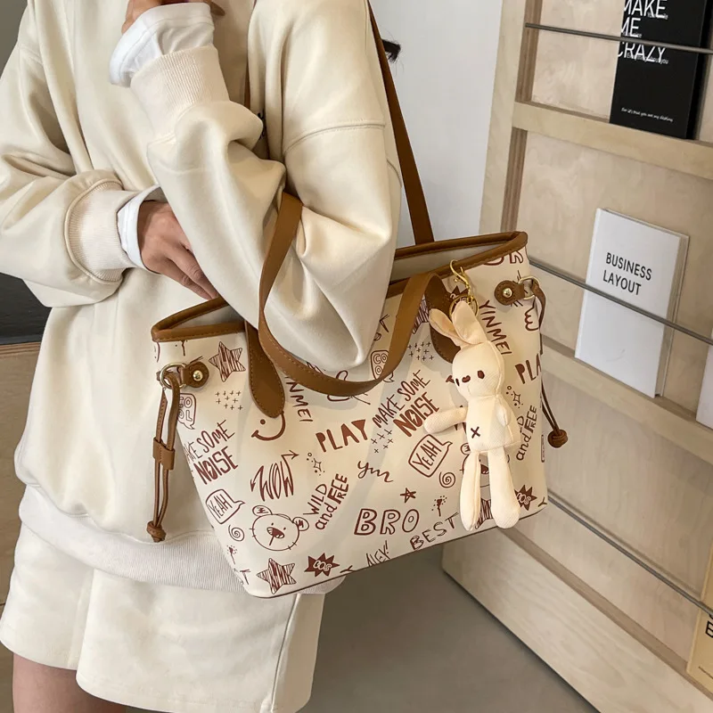 Tote Female Large Capacity Shoulder High Sense Big 2024 New Niche Graffiti Commuter Bag
