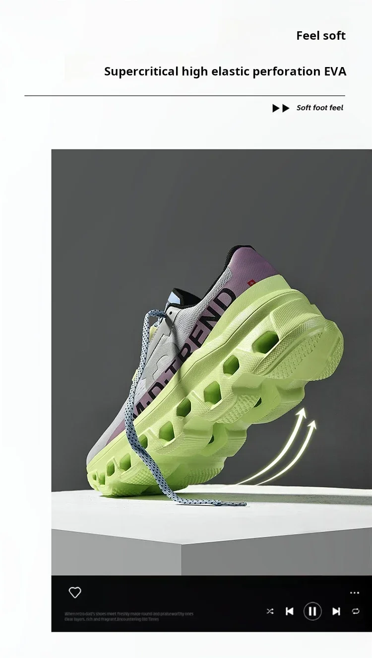 Side view of white unisex trainers on concrete sidewalk