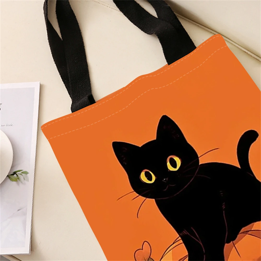 Black cat pumpkin pattern printed casual handbag, reusable fashionable backpack, multifunctional handbag, canvas shopping bag