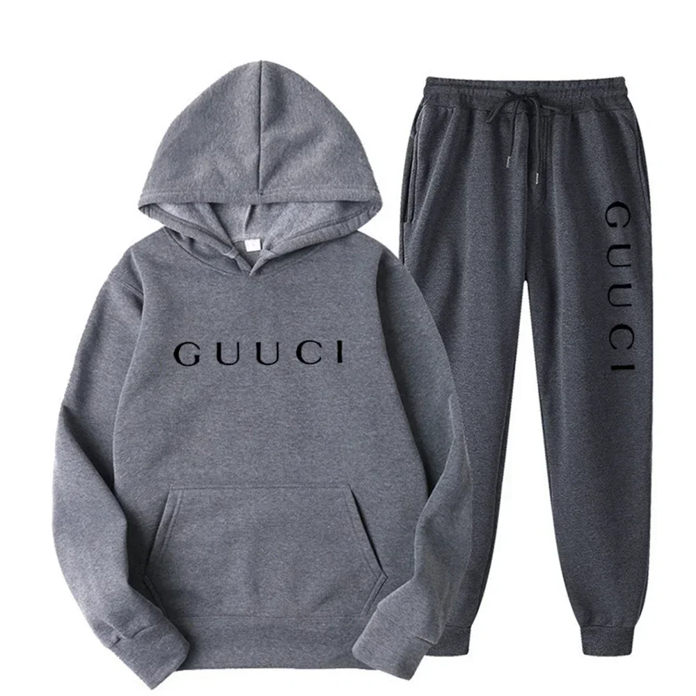 Man wearing autumn streetwear jogging set in urban outdoor setting dark gray