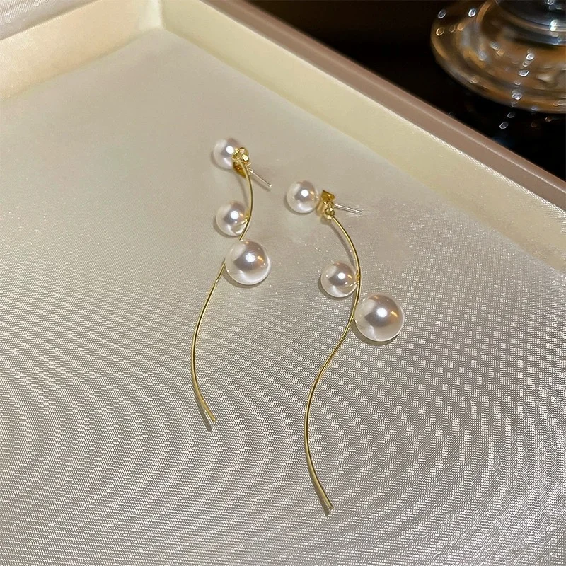Side angle of the earrings showing tassel movement