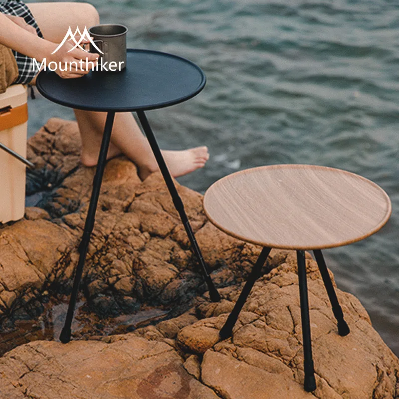 

The Mountain's external portable, lift-adjustable aluminium folding round table