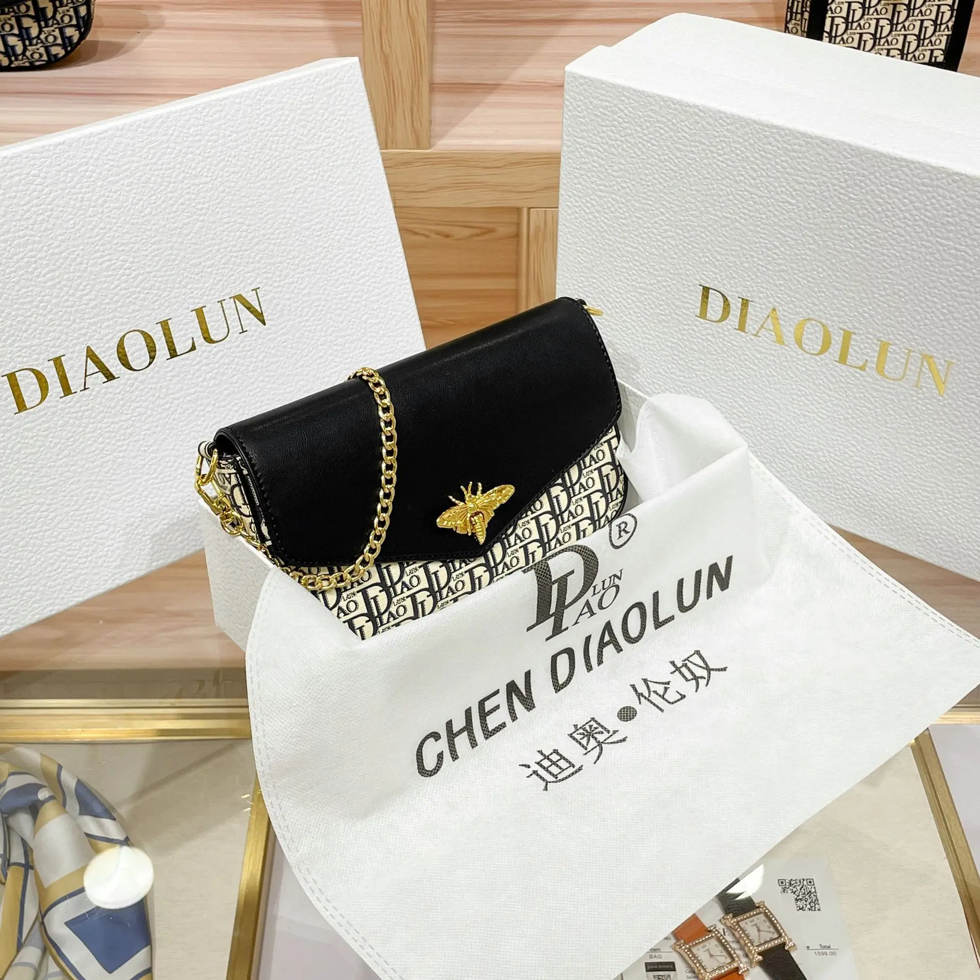 

DIAOLUN's self created brand D women's bag envelope bag chain small bag mobile phone bag new versatile single shoulder diagonal