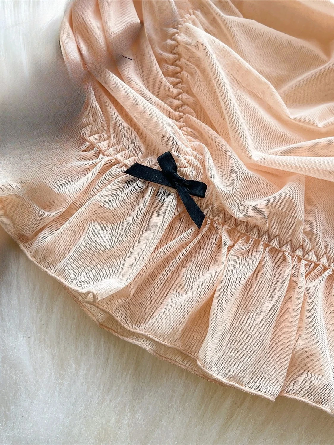Embroidered Ruffle Dress with slight stretch fabric, fit-and-flare shape, and elegant mini length