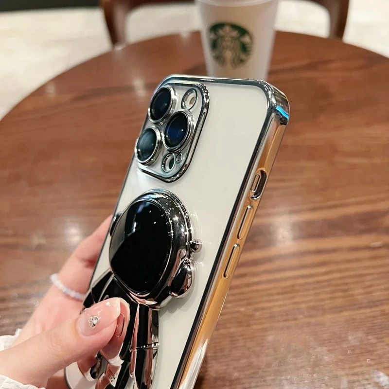 Moda Fold Standing Custodia per telefono trasparente per IPhone 11 12 13 14 15 Pro Mini XS Max XR X Placcatura Astronauta Protegge la copertura_voghion.com