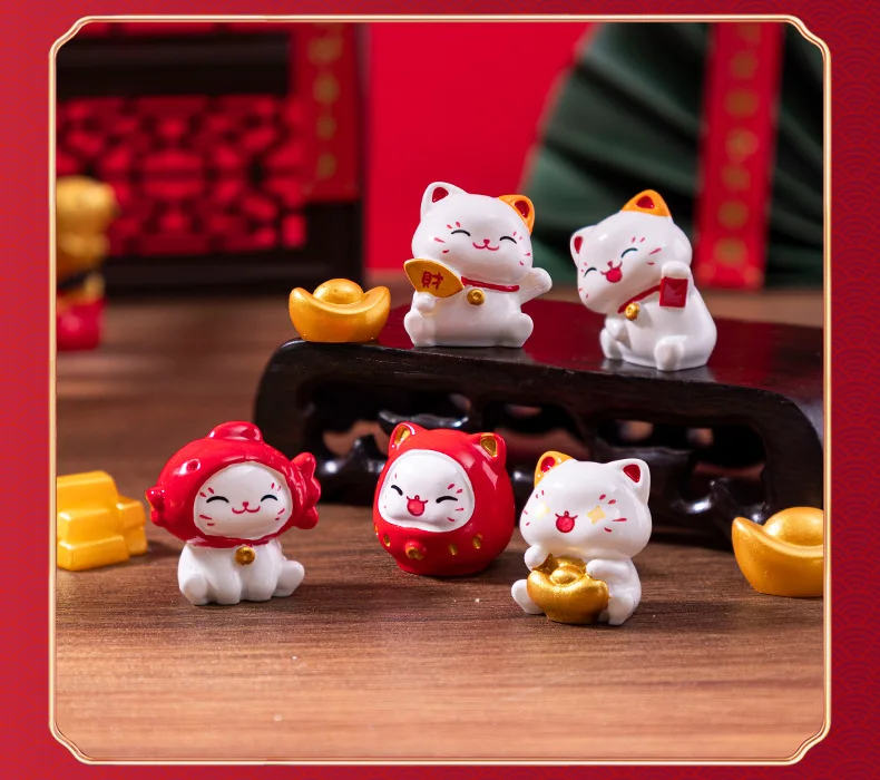 Five KittyNook Cat Co. Chinese Cartoon Fortune Cat Ornaments with gold ingots make a meaningful festive gift.