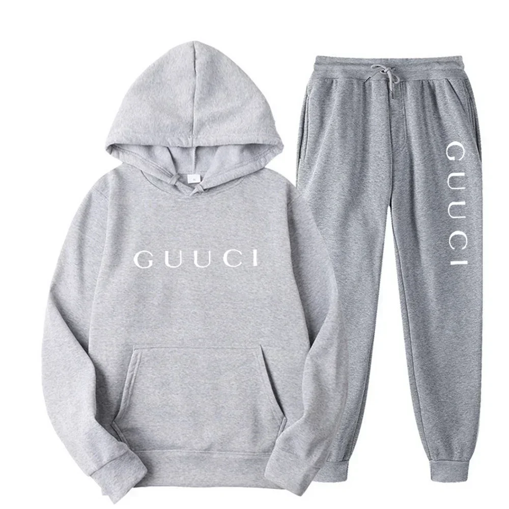 Man wearing autumn streetwear jogging set in urban outdoor setting dark