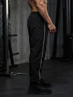 Pantalon de sport tendance pour hommes avec lignes, pantalon de course, d'entraînement, de gymnastique, avec poches latérales, pantalon de survêtement athlétique respirant à séchage rapide 2