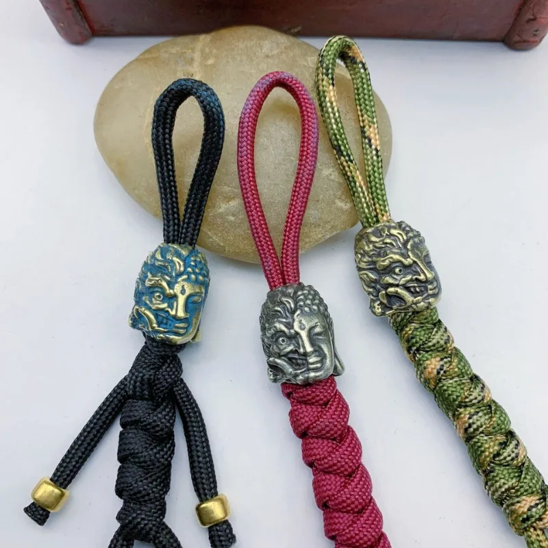 

Half Devil Half Buddha Face Brass Paracord Bead DIY Umbrella Rope EDC Bracelet Accessories Knife Lanyard Pendant Religious Charm