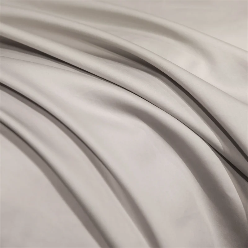 4-Piece Egyptian Cotton Embroidery Bedding Set with solid color design on bed