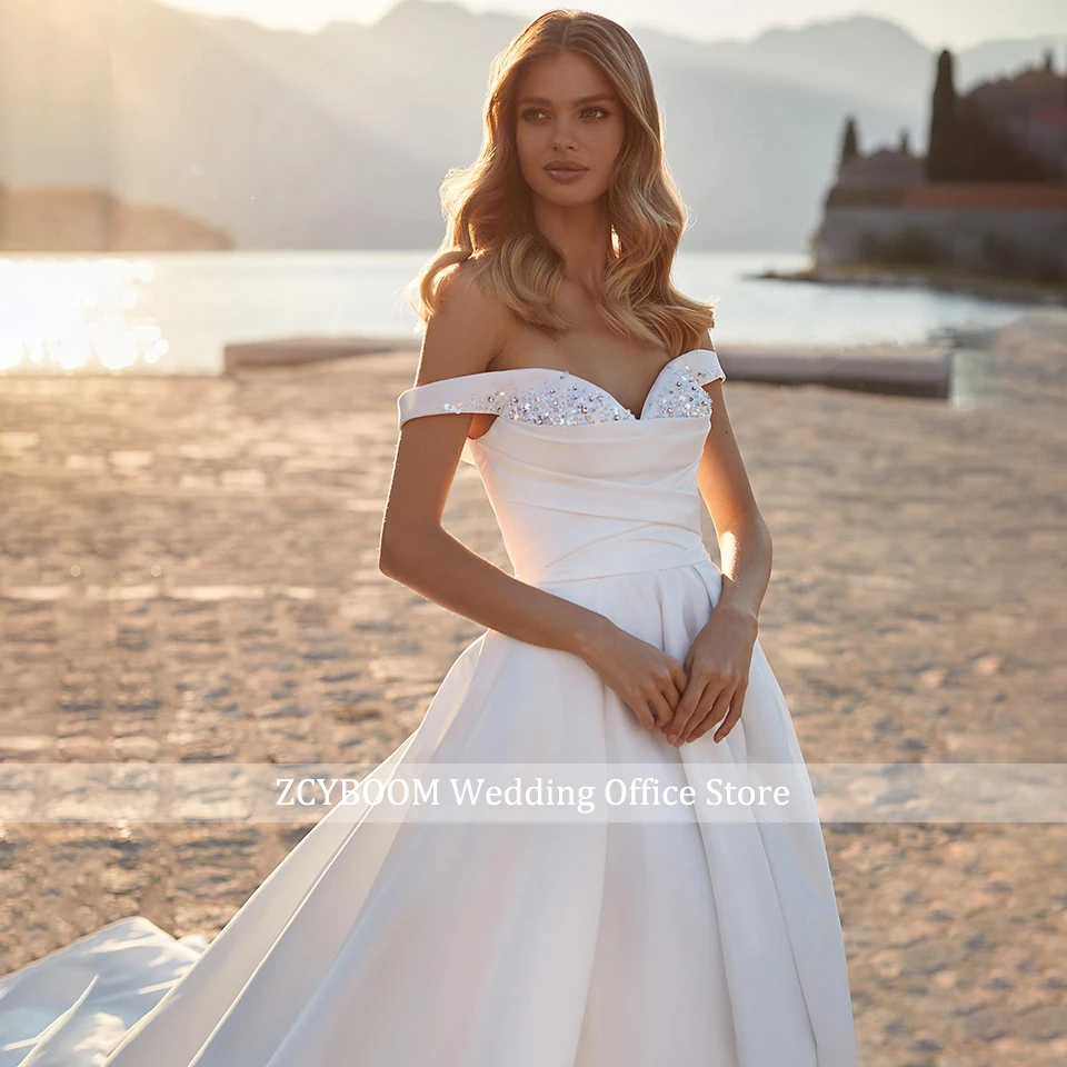 Weißes Satin A-Linien Brautkleid 2026 Ärmellos mit Sweetheart-Ausschnitt Korsett-Rücken Off-Shoulder Glitzernde Perlenstickerei Brautkleid Vestido De Novia – Detail 6