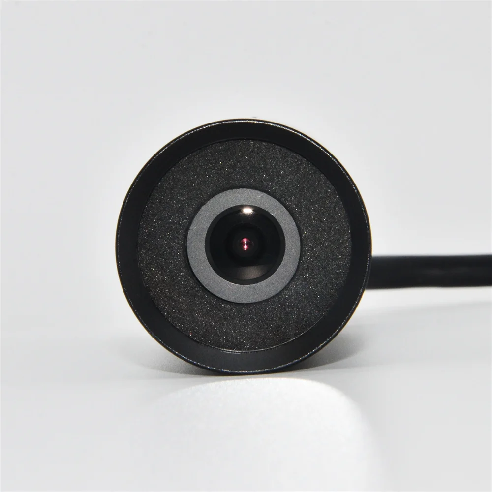 Mini camera with mounting bracket displayed on table