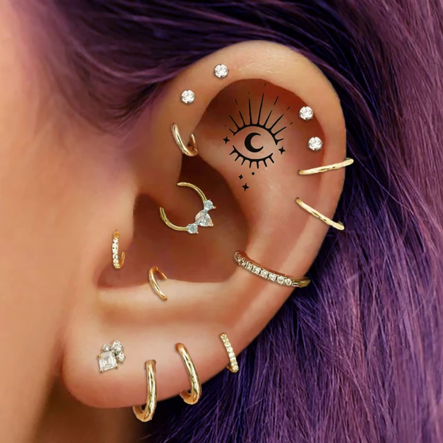 Jewelry ideas for two somewhat randomly placed conch piercings? Both are  fully healed (bottom is 10 years old, top is a year old). The hoops in the  bottom are irritating and I