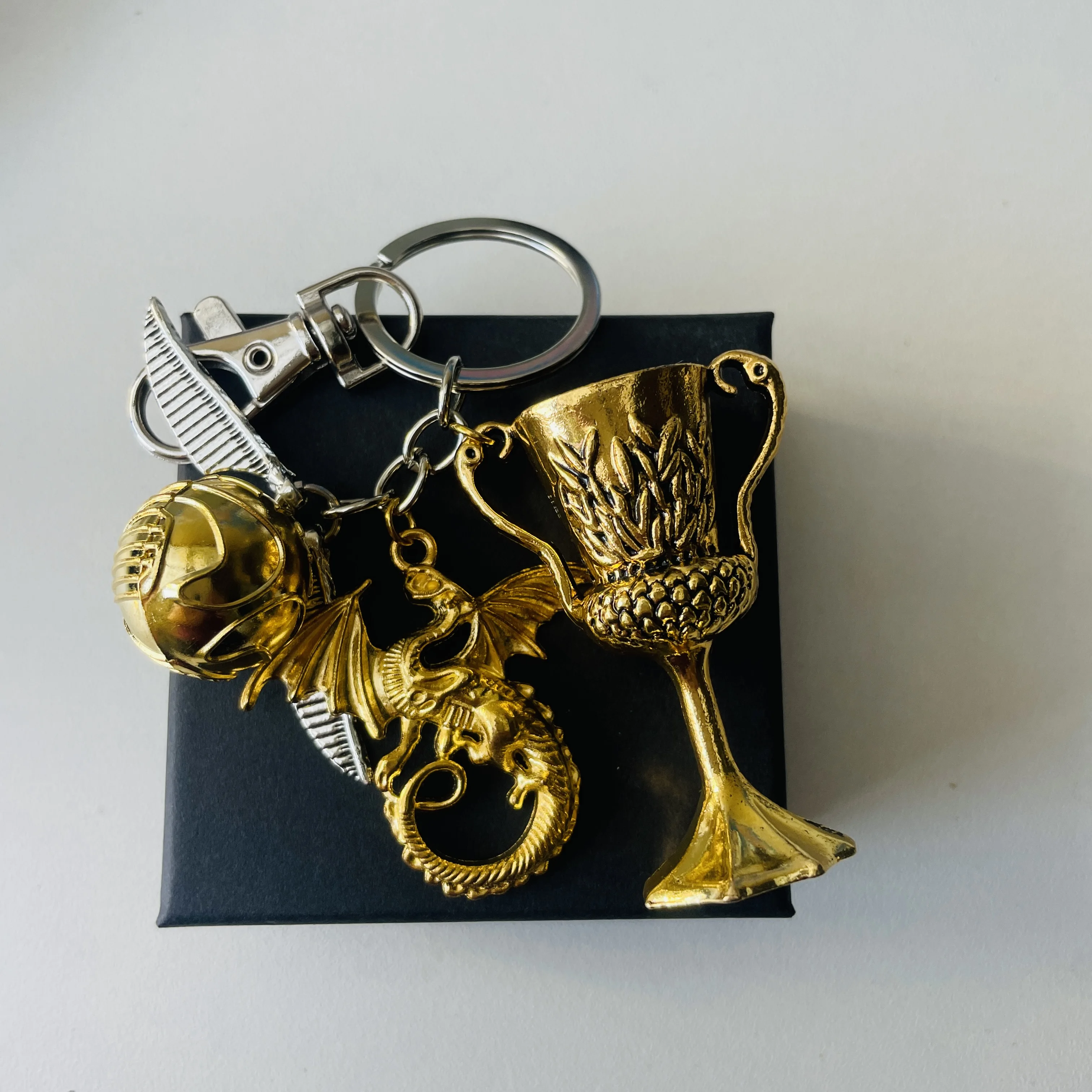 

High Feet Holy Grail Cup Golden Winged Flying Ball Fire Dragon Combination Pendant Keychain Box 2pc Set Bag Backpack Decoration