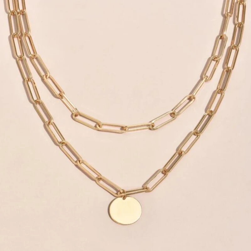 A trendy women's fashion accessory, a Charm Layered Necklace for Women with a coin pendant.