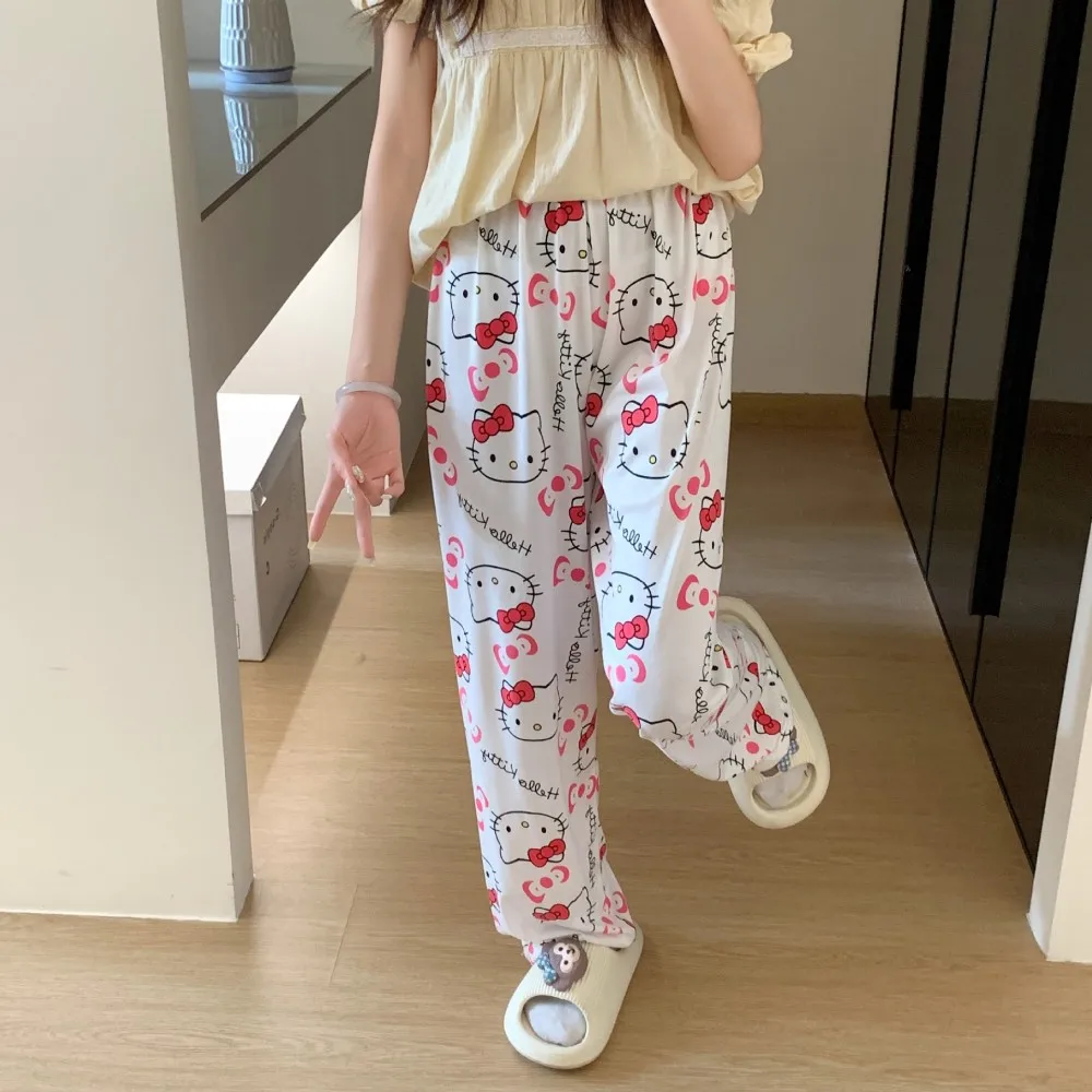 A pair of loose-fitting Hello Kitty pajama pants with a charming cartoon print gray