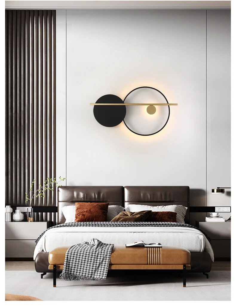 A minimalist Scandinavian designed bedroom with a bed and a circular wall sconce.