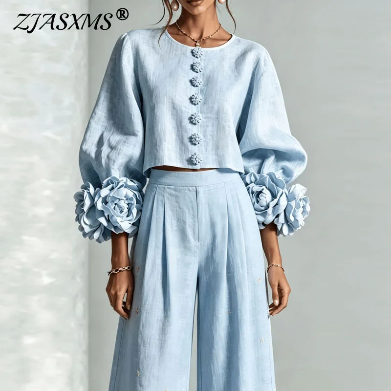 Ensemble 2 pièces pour femmes avec manches bouffantes et col rond, comprenant un haut court à motifs floraux 3D et un pantalon à jambes larges. Tenue élégante et décontractée pour le bureau ou les soirées. 1