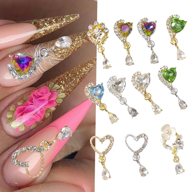Placing Small Gold Gemstones on the Surface of a Polished Red Nail with a  Fine Brush. Nail Art Procedure and Finishing Touches Stock Photo - Image of  anonymous, decoration: 239729026