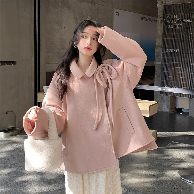 

Autumn and winter 2021 new gentle temperament design sense bandage solid color long sleeved tweed coat women's outer top