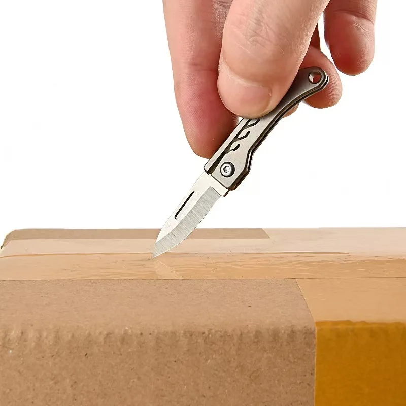 Titanium Alloy Mini Folding Knife Made of High Hardness Steel for Quick Opening, Portability, and Strong Practicality 4