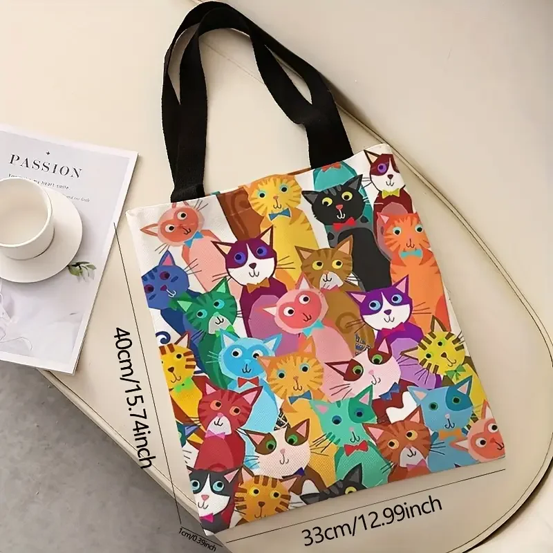 KittyNook Cat Co. Playful Kitten Print Canvas Handbag with black handles; eco-friendly and stylish. Dimensions shown.