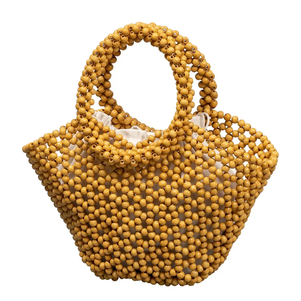 Women's Woven bag new hollow out bucket bag summer design commuter wood bead totes bag bohemian travel beach handbag Clutch bags