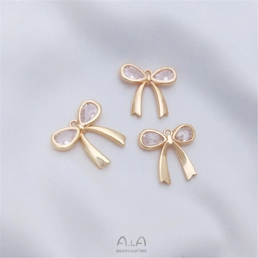 

Подвеска в виде банта из циркония, инкрустированная золотом 14 карат