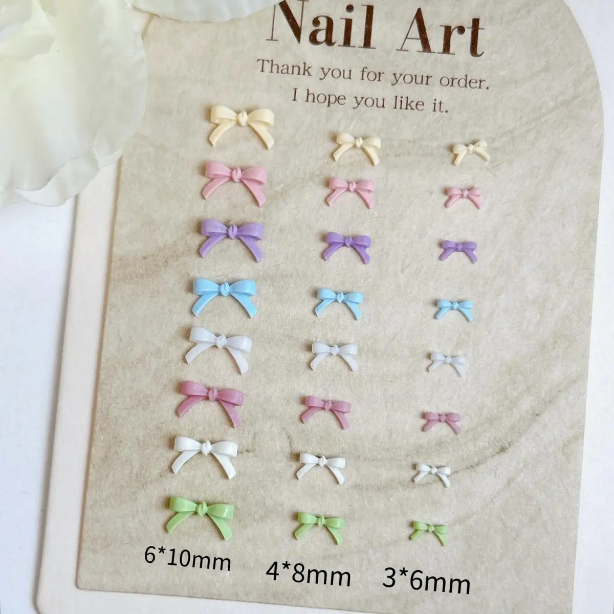 60PCS 여러 색상 미니 수지 Bowknots 네일 매력 3D 미니멀리스트 귀여운 라인 활 DIY 달콤한 매니큐어에 대한 네일 아트 장식