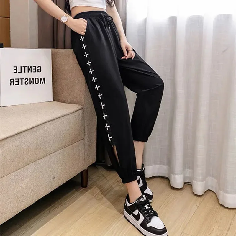 2023 New Summer Fashion Trend Mesh Hollowed Out Print Quick Drying Loose Casual Leggings Thin Cropped Women's Casual Pants