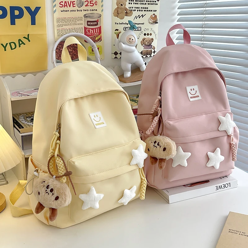 Cute Pink Backpack for Girls Fashionable Star Decorated School Bag with Plush Charm Ideal for Daily Use and School Cute Style Ba 2