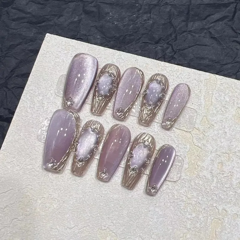 Set of 10 short naked cat eye press on false nails featuring a sparkling laser butterfly decoration on full cover plastic tips.