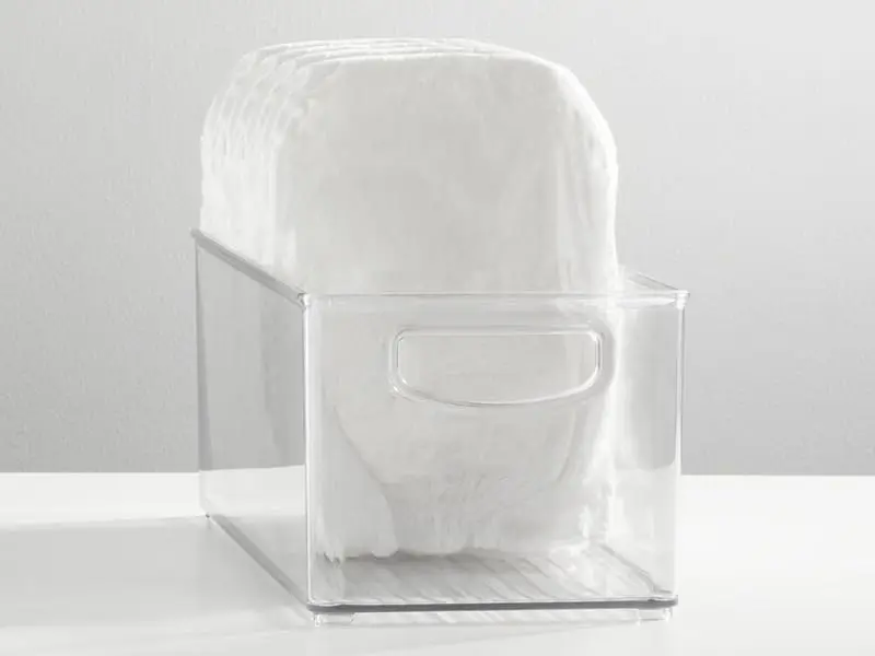 plastic baby bin with d-shaped handle holding diapers