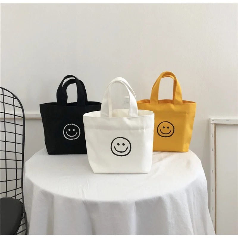 Custom  Summer New Arrival Girlish Style Mini Small and Fresh Cute Smiling Face Girl Canvas Bag Portable Lunch Box custom summer new arrival girlish style mini small and fresh cute smiling face girl canvas bag portable lunch box