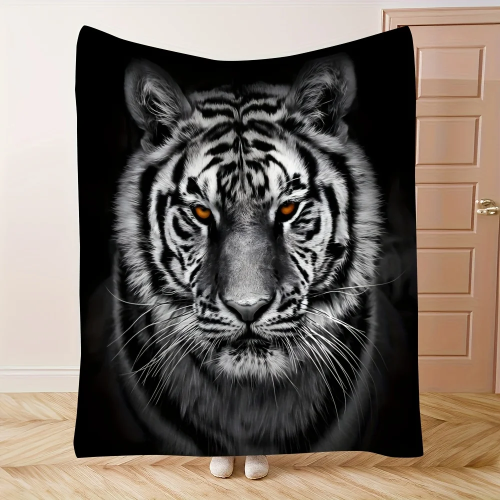 Black flannel blanket with lifelike white tiger pattern, showing