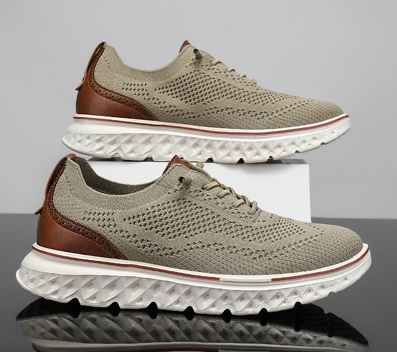 Pair of brown mesh sneakers with soft soles placed on a concrete surface, highlighting breathable texture and sporty silhouette 65987