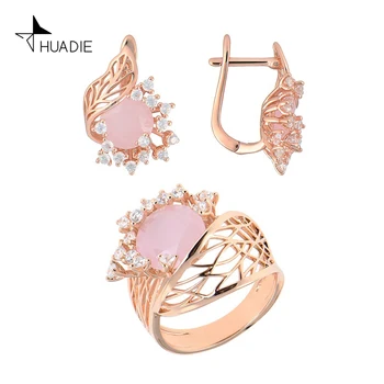 

Huadie jewelry set with zircons. Women's earrings with stones and a wide ring with a pink flower. Jewelry 2020