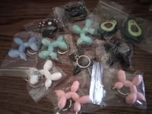 Nuevo creativo de dibujos animados globo de Llavero perro colgante anillo de hombres y mujeres par bolsa de llavero colgante venta al por mayor