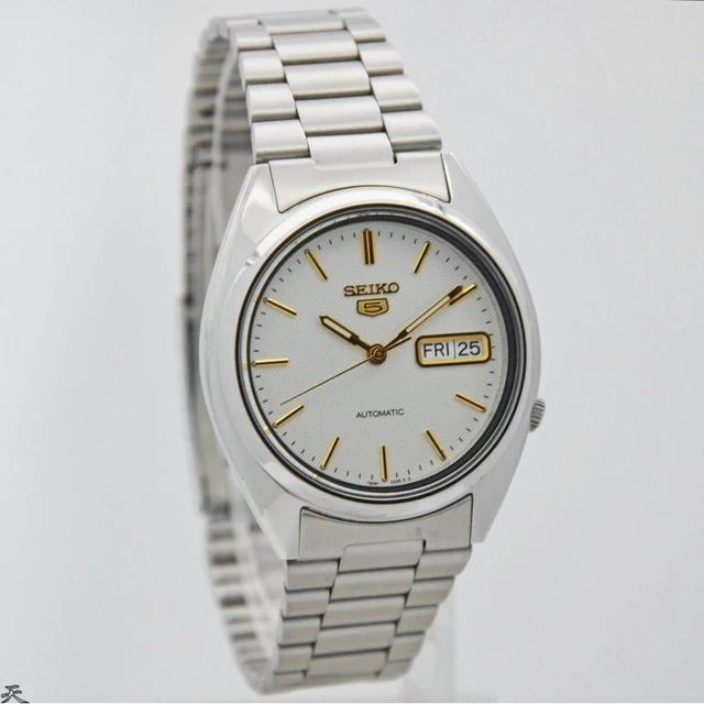 Reloj Seiko 5 SNXG47K1 automático plateado y dorado