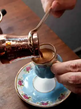 

Hot Turkish Coffee delightful brewed Not Italian espresso beverage make a cup of coffee with froth