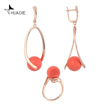 

Huadie jewelry set with pearls. Women's long hanging unusual earrings pendants and a thin ring with pearls. Fashion 2020