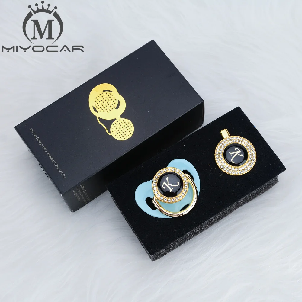 https://ae01.alicdn.com/kf/U18a4fa488ea94df4832ecc6026a7a7f88/MIYOCAR-name-Initials-letter-K-beautiful-bling-pacifier-and-pacifier-clip-set-unique-BPA-free-dummy.jpg