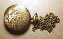 Reloj de bolsillo de cuarzo con números romanos para hombre y mujer, colgante de reloj de bolsillo árabe, con engranaje hueco, Estilo Vintage, Unisex, 1 unidad