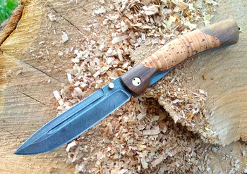 

Knife folding parrot with a blade made of Damascus steel.